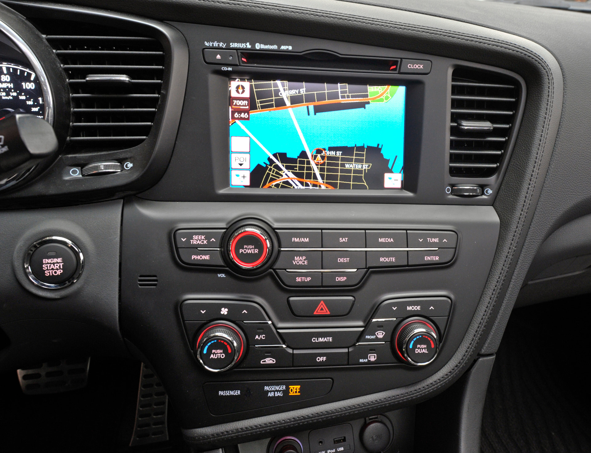 Kia Optima production interior showing the instrument panel, center stack, and front seats